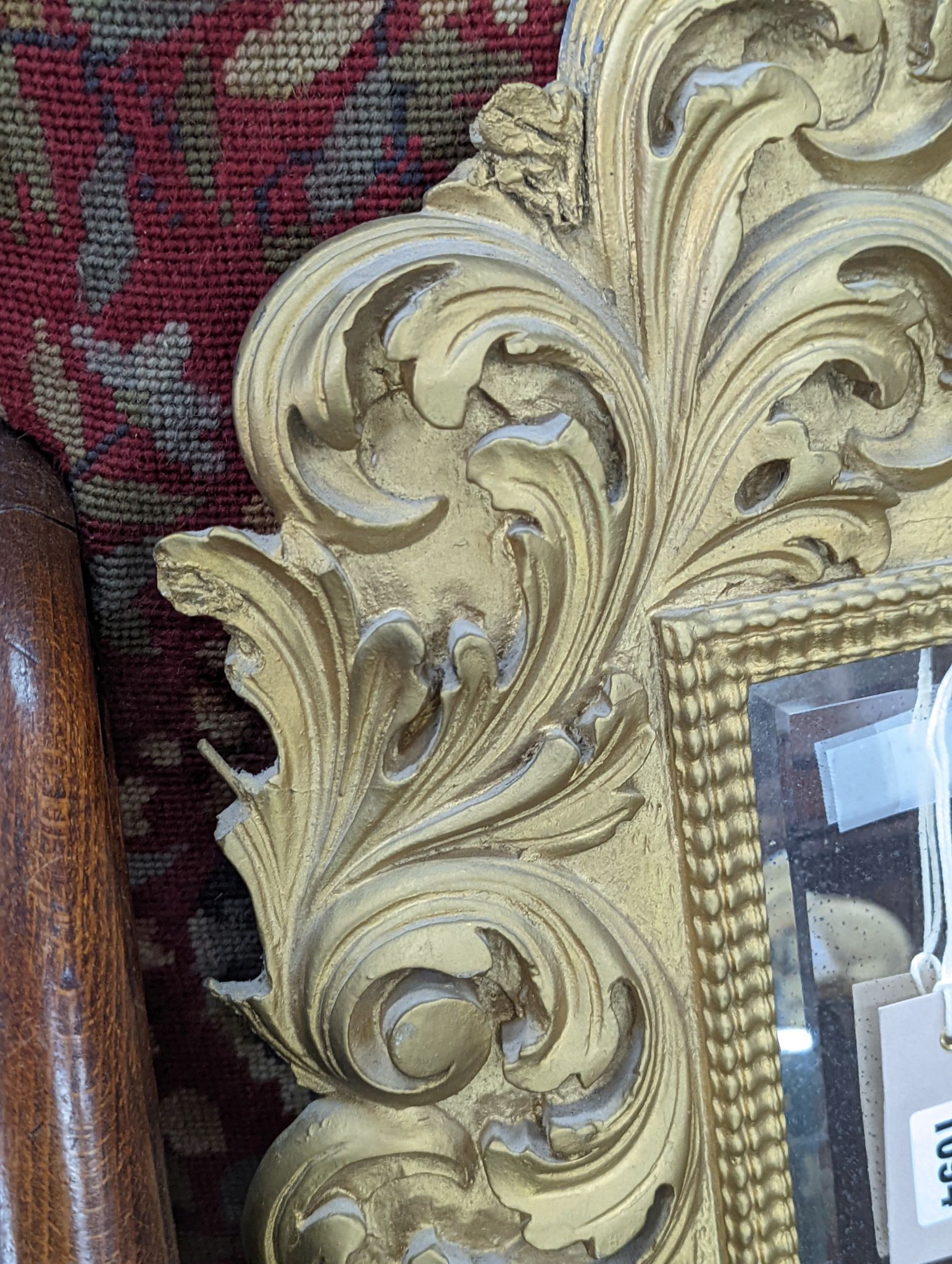 A small Florentine style gilt plaster acanthus scroll wall mirror, width 38cm, height 53cm